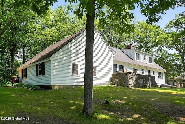 47 Mountainview Ter, North Greenbush, NY 12144 - view of side of home with a yard, a chimney, and a shingled roof