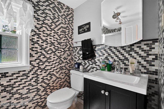 47 Mountainview Ter, North Greenbush, NY 12144 - full bath with decorative backsplash, vanity, a shower, tile walls, and plenty of natural light