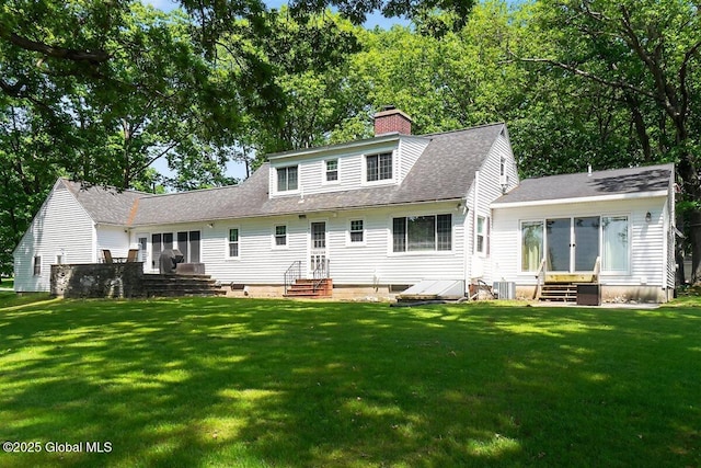 47 Mountainview Ter, North Greenbush, NY 12144 - rear view of house featuring entry steps, a chimney, a lawn, and a shingled roof
