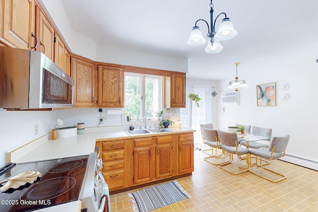 9 Arlene Ave, Guilderland, NY 12203 - kitchen featuring stainless steel appliances, a chandelier, light countertops, decorative light fixtures, and brick patterned flooring
