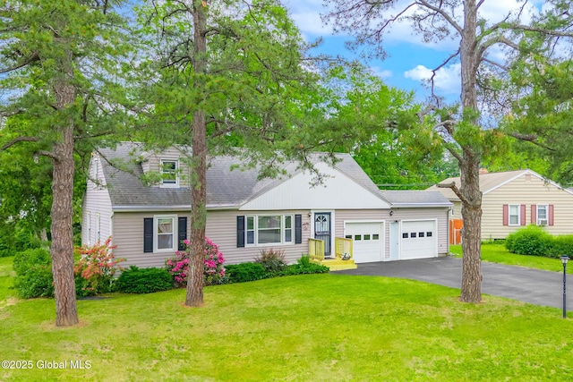 9 Arlene Ave, Guilderland, NY 12203 - cape cod home with a garage, driveway, a front lawn, and roof with shingles