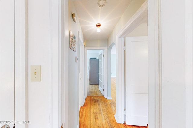 9 Arlene Ave, Guilderland, NY 12203 - corridor with arched walkways and light wood-style flooring