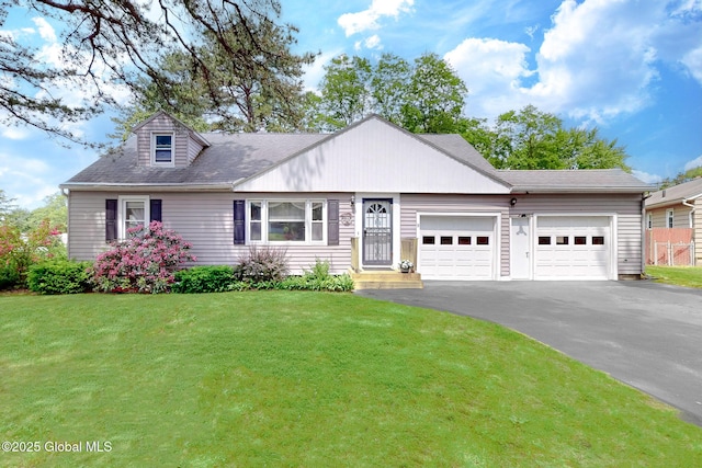 9 Arlene Ave, Guilderland, NY 12203 - view of front of house featuring driveway, an attached garage, a front yard, and a shingled roof