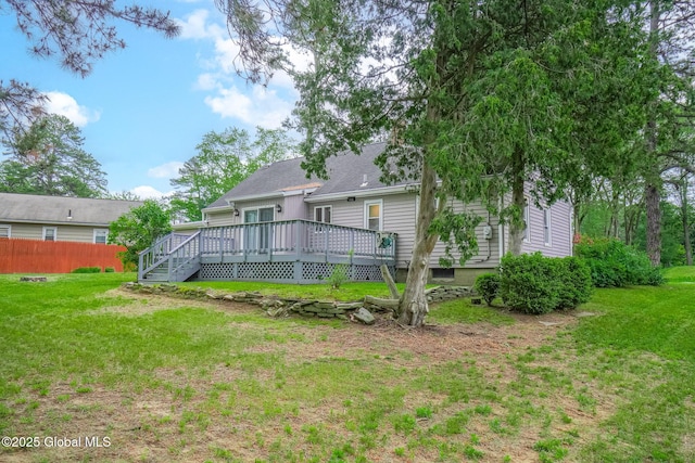 9 Arlene Ave, Guilderland, NY 12203 - rear view of house with a wooden deck and a shingled roof