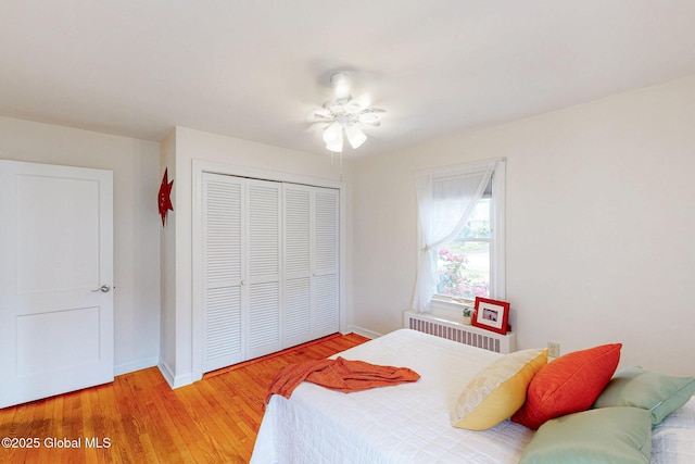 9 Arlene Ave, Guilderland, NY 12203 - bedroom featuring radiator, a closet, light wood-style flooring, and ceiling fan