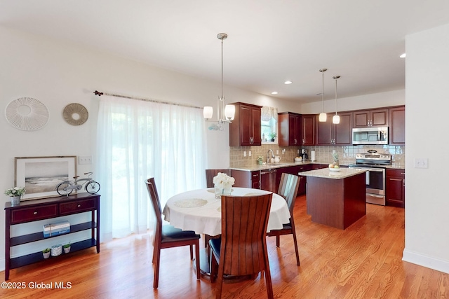 113 Fieldstone Dr, Niskayuna, NY 12304 - dining area featuring light wood-type flooring and recessed lighting