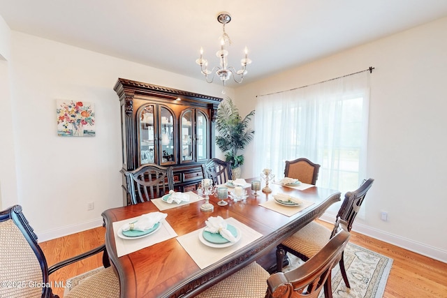 113 Fieldstone Dr, Niskayuna, NY 12304 - dining space with a chandelier and light wood finished floors
