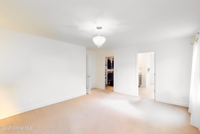 113 Fieldstone Dr, Niskayuna, NY 12304 - empty room with light colored carpet and a chandelier