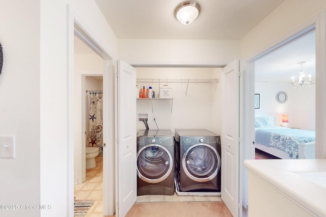 113 Fieldstone Dr, Niskayuna, NY 12304 - washroom with washing machine and dryer and a chandelier