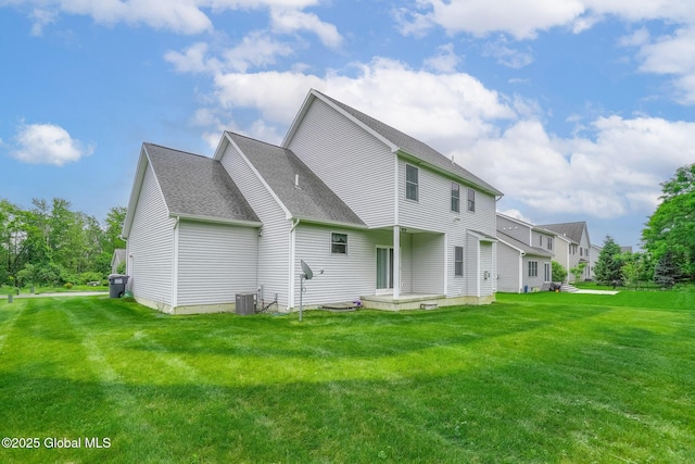 113 Fieldstone Dr, Niskayuna, NY 12304 - rear view of house featuring a shingled roof and a lawn