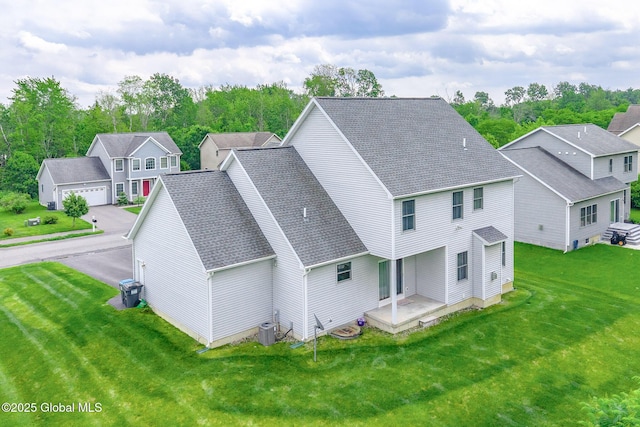 113 Fieldstone Dr, Niskayuna, NY 12304 - rear view of property featuring a yard, a shingled roof, and a residential view