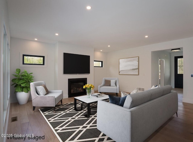 101 W High St, Ballston Spa, NY 12020 - living room with recessed lighting, wood finished floors, and a glass covered fireplace