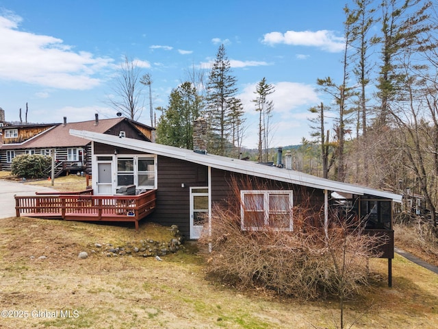 4A High Pines Ter, Warrensburg, NY 12817 - view of front of house featuring a deck and a chimney