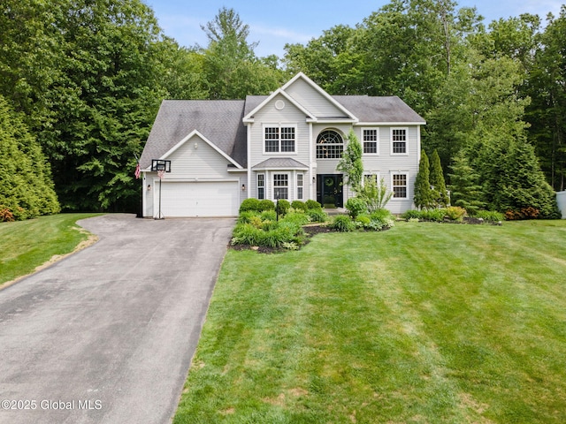 10 Overlook Dr, Wilton, NY 12831 - view of front facade featuring asphalt driveway, a garage, and a front lawn