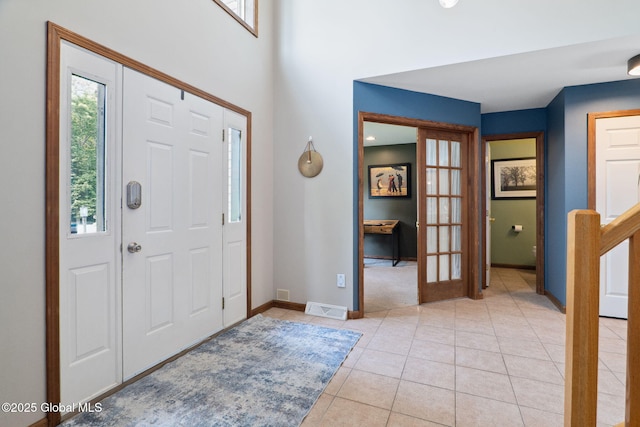 10 Overlook Dr, Wilton, NY 12831 - entrance foyer with light tile patterned floors and french doors