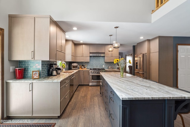 10 Overlook Dr, Wilton, NY 12831 - kitchen featuring high end appliances, a kitchen island, light stone counters, dark wood finished floors, and under cabinet range hood