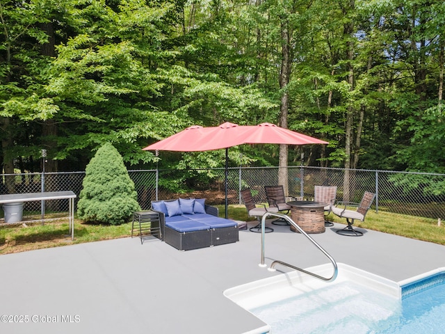 10 Overlook Dr, Wilton, NY 12831 - view of patio / terrace featuring an outdoor living space with a fire pit and a view of trees
