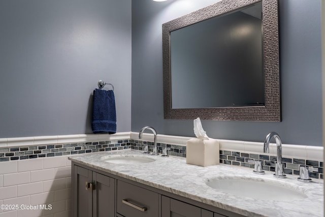 76 Hoffman Ct, Milton, NY 12020 - bathroom featuring double vanity, tile walls, and a wainscoted wall