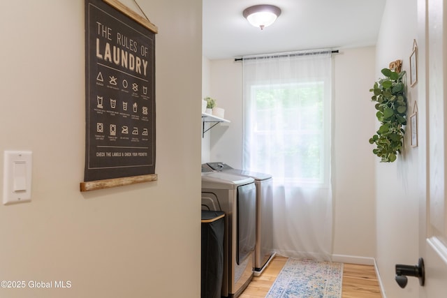 76 Hoffman Ct, Milton, NY 12020 - laundry area featuring separate washer and dryer and wood finished floors