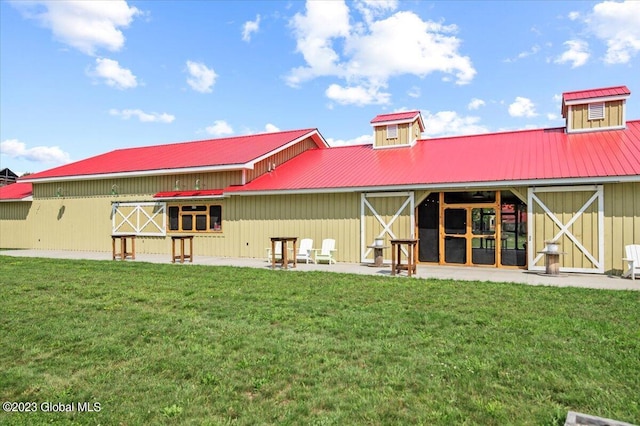 284 Edgemont Rd, Moriah, NY 12960 - back of house with a lawn, a metal roof, and board and batten siding