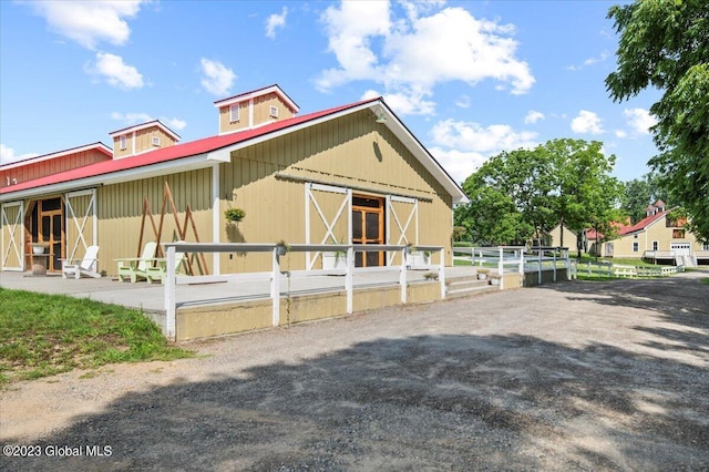284 Edgemont Rd, Moriah, NY 12960 - view of front of property with an exterior structure, a metal roof, and an outdoor structure