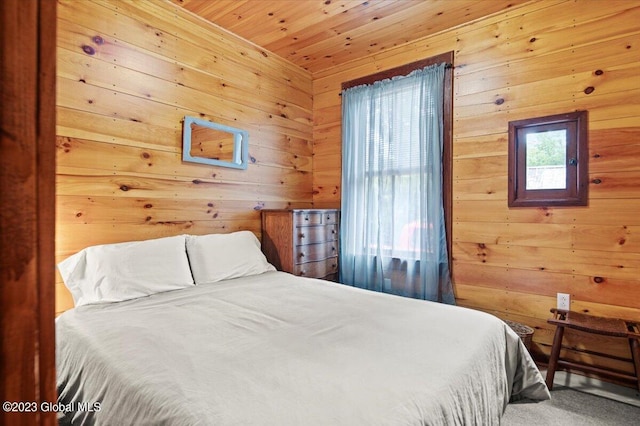 284 Edgemont Rd, Moriah, NY 12960 - bedroom with wooden walls, wood ceiling, and carpet flooring