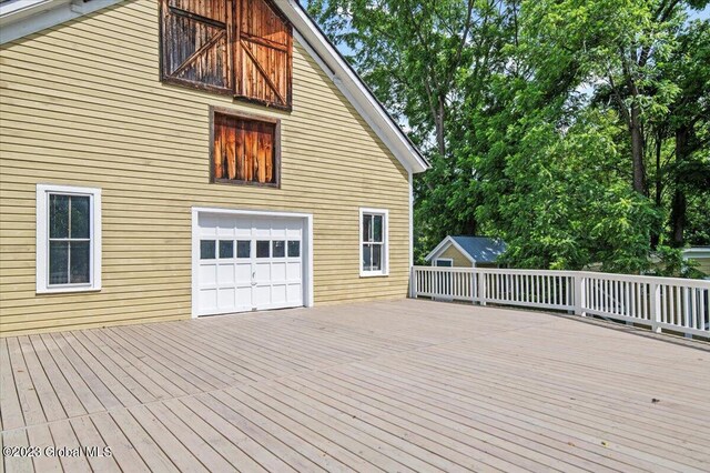 284 Edgemont Rd, Moriah, NY 12960 - wooden deck featuring a garage