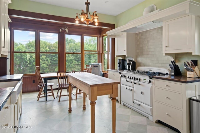 284 Edgemont Rd, Moriah, NY 12960 - kitchen with cooktop, light floors, and plenty of natural light