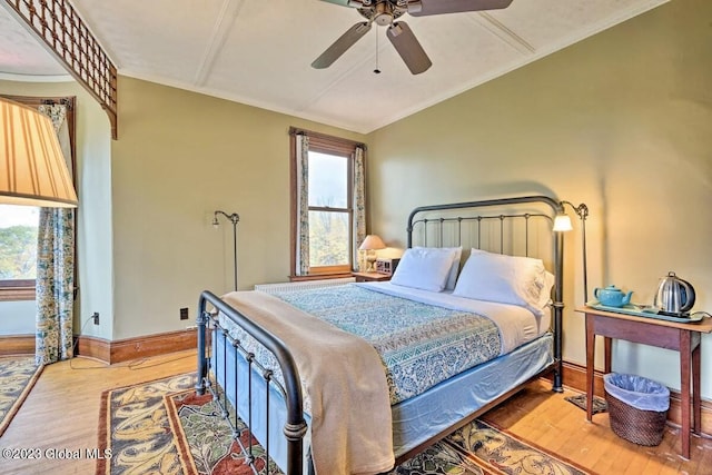 284 Edgemont Rd, Moriah, NY 12960 - bedroom featuring wood finished floors, vaulted ceiling, and ceiling fan