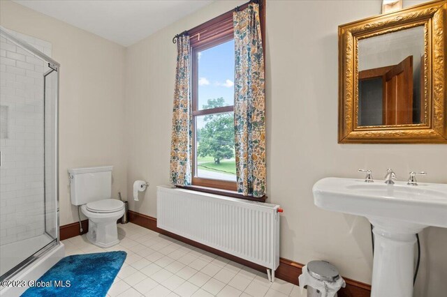 284 Edgemont Rd, Moriah, NY 12960 - bathroom with radiator, a stall shower, and tile patterned floors