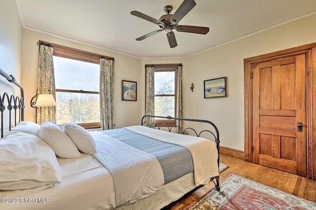 284 Edgemont Rd, Moriah, NY 12960 - bedroom featuring light wood-style floors, crown molding, and ceiling fan