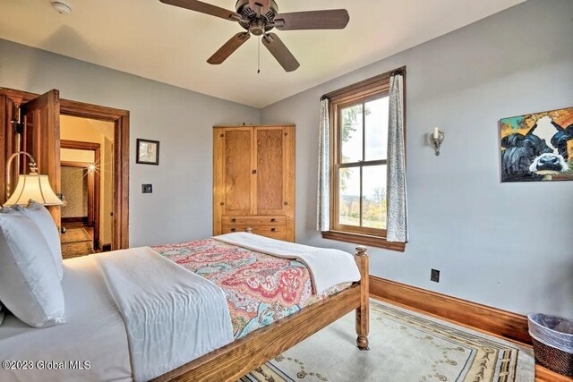 284 Edgemont Rd, Moriah, NY 12960 - bedroom featuring vaulted ceiling, ceiling fan, and wood finished floors