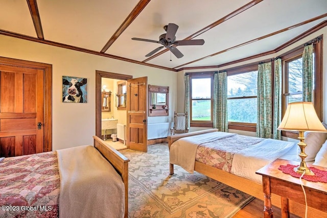 284 Edgemont Rd, Moriah, NY 12960 - bedroom with wood finished floors, crown molding, ensuite bathroom, and ceiling fan