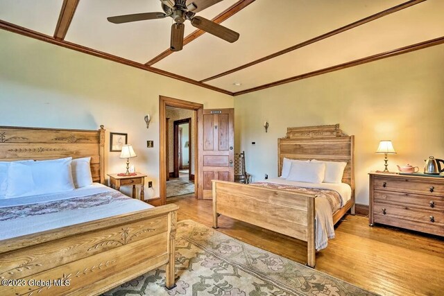 284 Edgemont Rd, Moriah, NY 12960 - bedroom with wood finished floors, crown molding, and ceiling fan
