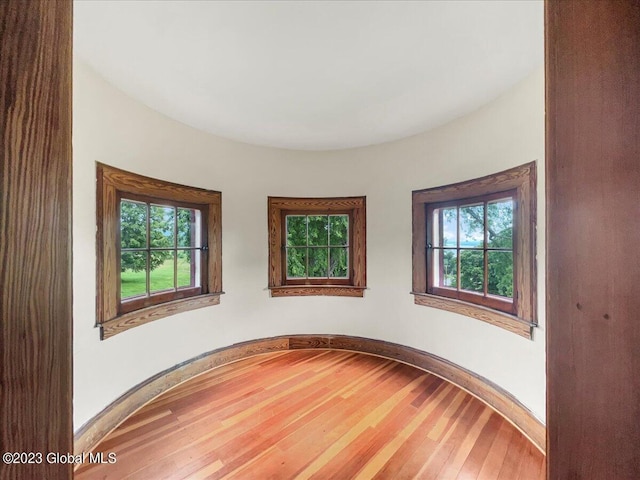 284 Edgemont Rd, Moriah, NY 12960 - empty room with plenty of natural light and wood finished floors