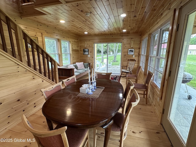 284 Edgemont Rd, Moriah, NY 12960 - dining space with recessed lighting, wooden ceiling, wood walls, light wood-style floors, and stairs