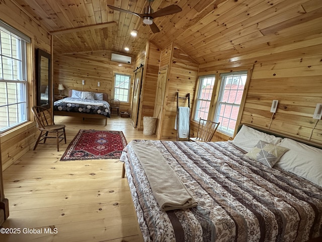 284 Edgemont Rd, Moriah, NY 12960 - bedroom featuring wood walls, vaulted ceiling, wooden ceiling, hardwood / wood-style floors, and a wall mounted AC