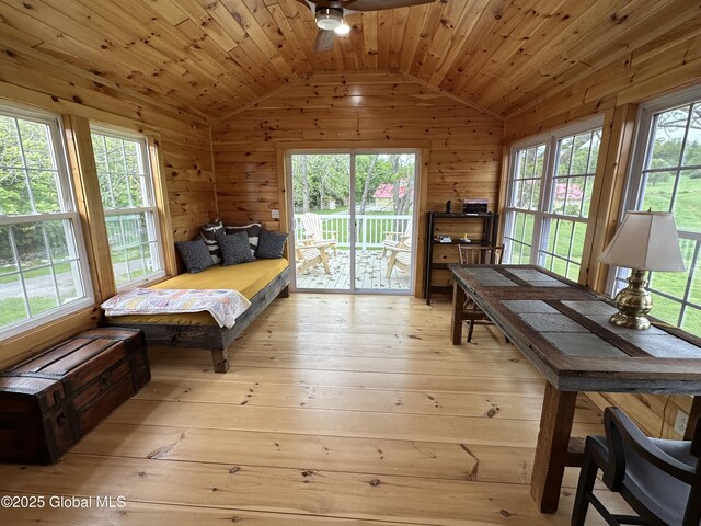 284 Edgemont Rd, Moriah, NY 12960 - bedroom featuring lofted ceiling, light wood finished floors, access to exterior, wood walls, and wooden ceiling