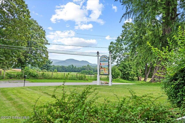 284 Edgemont Rd, Moriah, NY 12960 - view of property's community with a yard and a mountain view