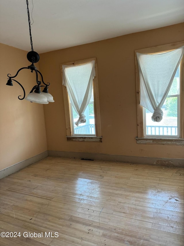 112 Mason St, Johnstown, NY 12095 - unfurnished dining area featuring light wood-style flooring and baseboards