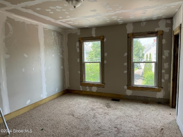 112 Mason St, Johnstown, NY 12095 - carpeted empty room with baseboards
