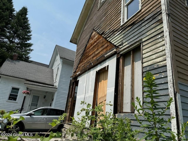 112 Mason St, Johnstown, NY 12095 - view of side of home featuring roof with shingles