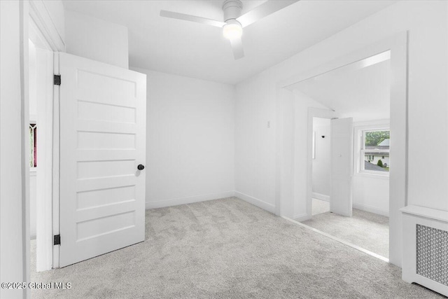 2321 1st Ave, Rotterdam, NY 12303 - unfurnished bedroom with carpet floors, radiator heating unit, and ceiling fan