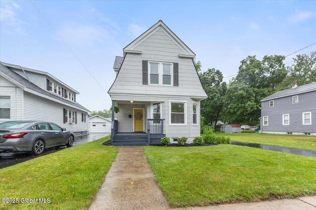 2321 1st Ave, Rotterdam, NY 12303 - view of front of home featuring an outdoor structure, a front yard, and a porch