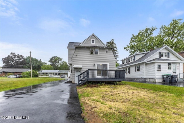 2321 1st Ave, Rotterdam, NY 12303 - view of front of house with asphalt driveway, a front lawn, and a deck