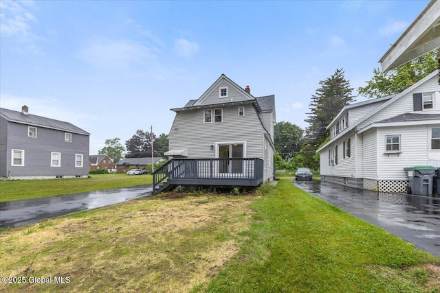 2321 1st Ave, Rotterdam, NY 12303 - rear view of house featuring a lawn, a deck, and a chimney