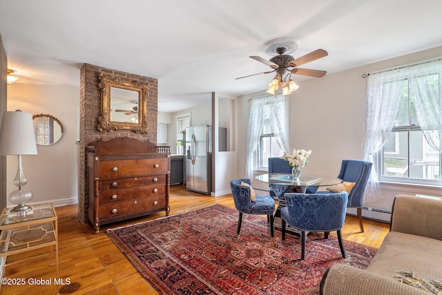 462-470 2nd Ave, Troy, NY 12182 - dining room with plenty of natural light, a baseboard heating unit, and light wood-style floors