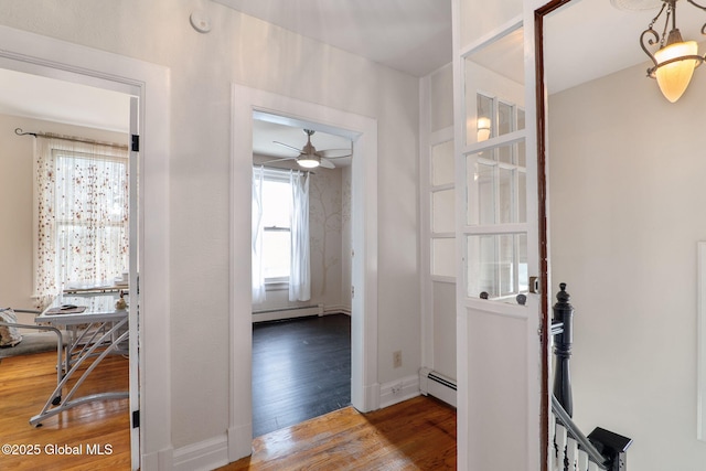 462-470 2nd Ave, Troy, NY 12182 - hallway with a baseboard radiator, wood finished floors, and an upstairs landing