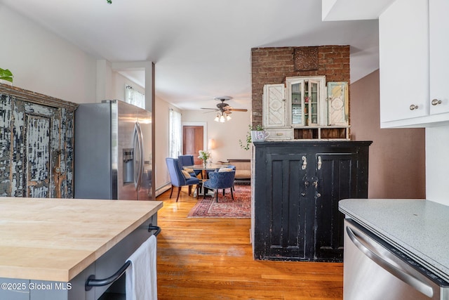 462-470 2nd Ave, Troy, NY 12182 - kitchen with appliances with stainless steel finishes, ceiling fan, light wood-type flooring, white cabinets, and butcher block counters