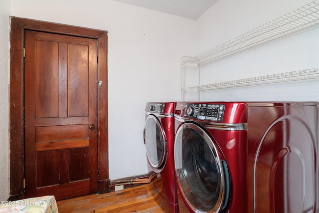 462-470 2nd Ave, Troy, NY 12182 - washroom featuring washing machine and clothes dryer and light wood-style flooring